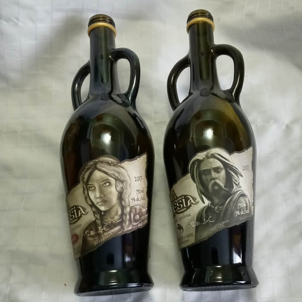 A) Two empty alcohol bottles for artistic creations